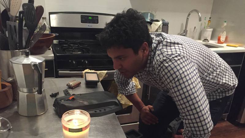 Boosted Board founder Sanjay Dastoor visits customer Rick Bross’s New York City apartment to examine a battery that started smoking inside his home. (Image: Rick Bross)